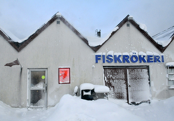A fish smokery shop in Smygehuk on Sweden's southernmost tip is covered by snow drifts on Thursday Dec. 2, 2010. Sweden's northernmost spot 1.572 kilometres farther north, enjoyed sunshine and balmy temperatures around zero as heavy snowfall and freezing temperatures hit Northern Europe for the third straight day. (AP Photo / Johan Nilsson)  SWEDEN OUT 
