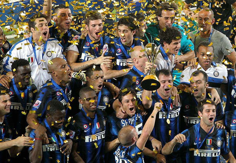 Inter Milan's players celebrate with the trophy after winning the 2010 FIFA Club World Cup at Zayed Sports City in the Emirati capital Abu Dhabi on December 18, 2010. European champions Inter Milan won 3-0 over African champions TP Mazembe of the Democratic Republic of Congo. AFP PHOTO/MARWAN NAAMANI