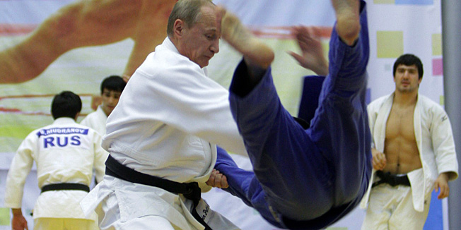 Russia's Prime Minister Vladimir Putin (foreground) takes part in a judo training session at the 