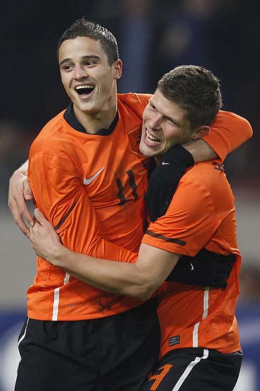 Ibrahim Affelay, left, hugs Klaas Jan Huntelaar, right, of the Netherlands after he scored 1- 0 against Turkey during their international friendly soccer match at ArenA stadium in Amsterdam, Netherlands, Wednesday Nov. 17, 2010. (AP Photo/Peter Dejong)