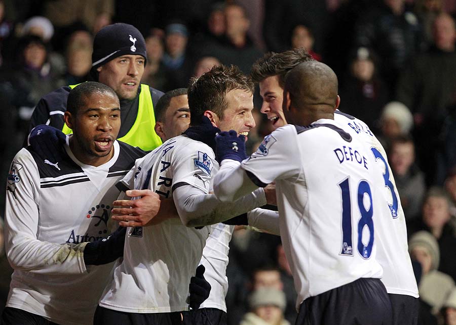 Tottenham Hotspur's Dutch player Rafael van der Vaart (3rd R) celebrates with team-mates after scoring the opening goal of the English Premier League football match between Aston Villa and Tottenham Hotspur at Villa Park in Birmingham, West Midlands, England on December 26, 2010. AFP PHOTO/IAN KINGTONFOR EDITORIAL USE ONLY Additional licence required for any commercial/promotional use or use on TV or internet (except identical online version of newspaper) of Premier League/Football League photos. Tel DataCo +44 207 2981656. Do not alter/modify photo.