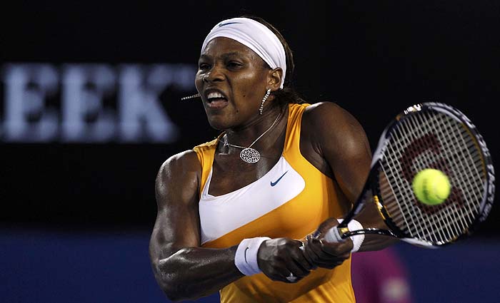 Serena Williams of the U.S. returns a shot against Belgium's Justine Henin during their women's singles final at the Australian Open tennis tournament in Melbourne January 30, 2010.  REUTERS/Mick Tsikas    (AUSTRALIA - Tags: SPORT TENNIS)