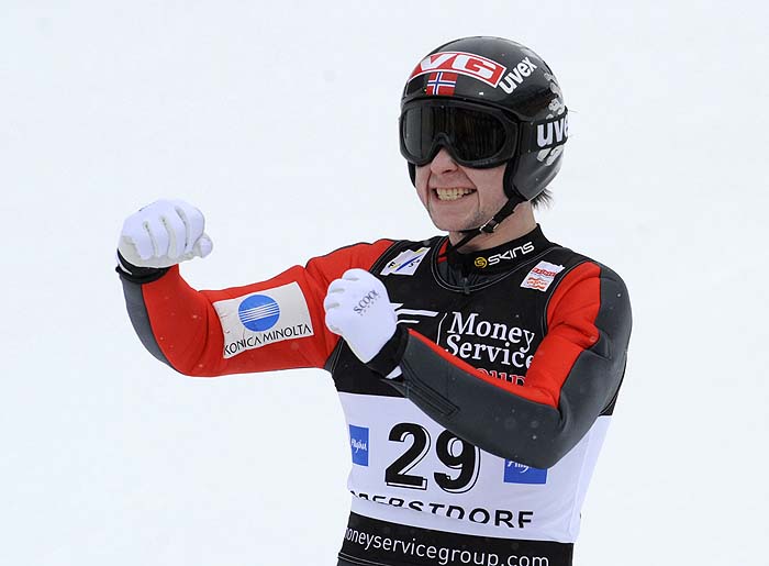 Norwegian Anders Jacobsen celebrates winning the men's single FIS Ski Jumping World Cup in the southern German town of Oberstdorf on January 31, 2010. Jacobsen won the event ahead of Slovenian Robert Kranjec (2nd) and Norwegian Johan Remen Evensen (3rd). AFP PHOTO DDP / TIMM SCHAMBERGER GERMANY OUT