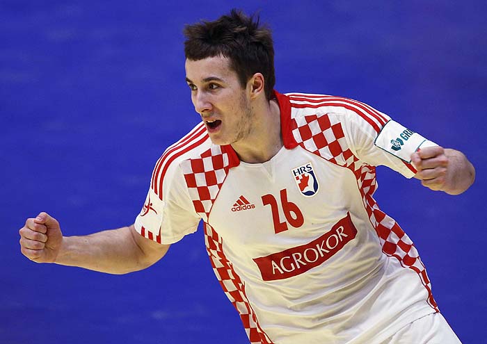 Croatia's Manuel Strlek celebrates his goal against  France during the Men's European Handball Federation Championship final match in Vienna, January 31, 2010.     REUTERS/Nikola Solic (AUSTRIA - Tags: SPORT HANDBALL)