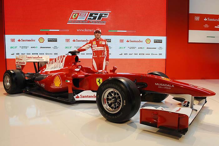 This handout image released by the Ferrari press office on January 28, 2010 shows Spanish Formula One driver Spanish Fernando Alonso posing with the new Ferrari F10 Formula one launched the same day at Maranello racetrack in Fiorano.  AFP PHOTO / HO / FERRARI PRESS OFFICE/ ERCOLE COLOMBO  