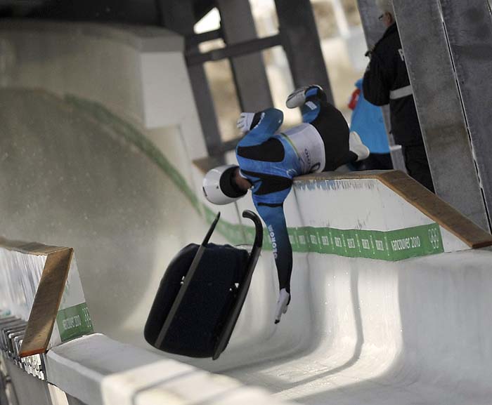 CORRECTION SPELLING OF ATHLETEGeorgian luge hopeful Nodar Kumaritashvili crashes during the men's Luge practise at the Whistler Sliding Centre, in preparation for the Vancouver Winter Olympics on February 12, 2010.  Kumaritashvili suffered a horror crash after flying off the Olympic track during his second of two training runs, reports said. He was immediately placed on a stretcher before he was taken away in an ambulance while an air ambulance was also on its way, the Globe and Mail said.  AFP PHOTO/Peter PARKS 