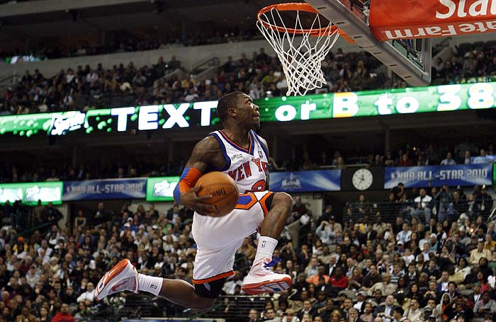 New York Knicks' Nate Robinson competes in the Slam Dunk contest on his way to winning the event during NBA All-Star weekend in Dallas, Texas February 13, 2010. REUTERS/Jessica Rinaldi (UNITED STATES - Tags: SPORT BASKETBALL)