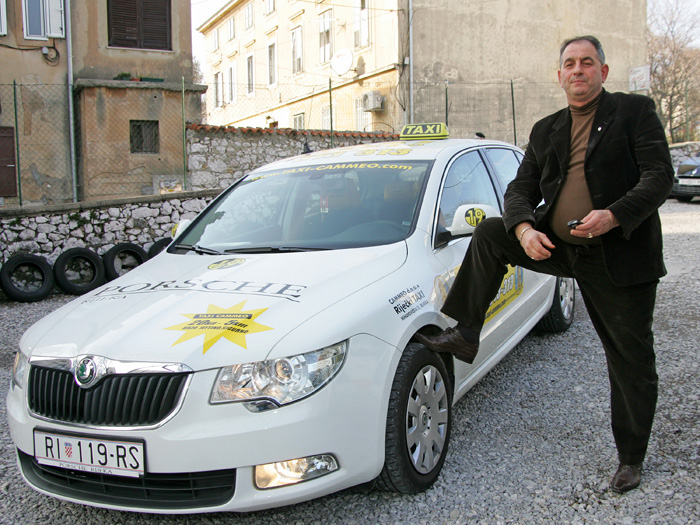Rijeka, 150210.Kosta Minoski vlasnik firme Cammeo taxi pokraj automobila Skoda Superb sa kojima ce poslovati po Zagrebu.Foto: Zeljko Sop / CROPIX