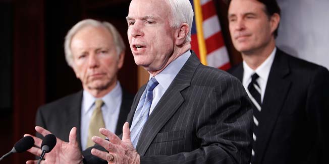 WASHINGTON - FEBRUARY 11: U.S. Sen. John McCain (R-AZ) (C) speaks as (L-R) Sen. Joseph Lieberman (D-CT), and Sen. Evan Bayh (D-IN) listen during a news conference on Capitol Hill February 11, 2010 in Washington, DC. The senators held a news conference to discuss Iran and proposed sanctions over human rights abuses.   Alex Wong/Getty Images/AFP== FOR NEWSPAPERS, INTERNET, TELCOS & TELEVISION USE ONLY ==