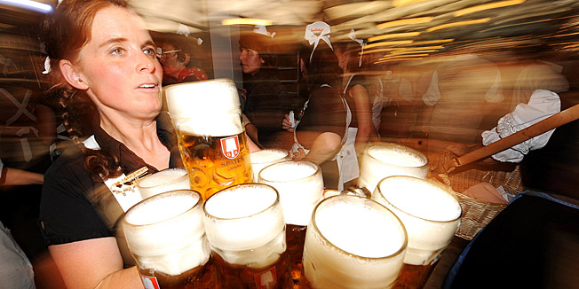 FILES - Picture taken on September 19, 2009 shows a waitress carriying beer mugs during the Oktoberfest beer festival at the 