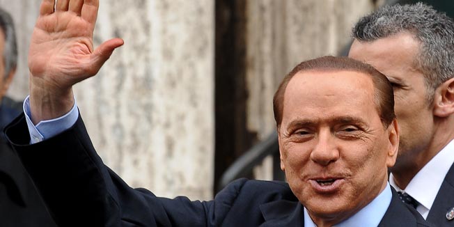 Italian Prime Minister Silvio Berlusconi waves as he leaves a memorial mass for his mother at the church of Santa Maria in Via on February 26, 2010 in Rome. A top Italian court yesterday threw out a corruption case against Berlusconi's former tax lawyer David Mills saying it was out of time, the ANSA news agency reported. AFP PHOTO / ANDREAS SOLARO