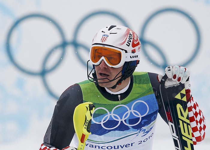 Croatia's Ivica Kostelic looks at his time after crossing the finish line during the men's first run of Alpine Skiing Slalom race at the Vancouver 2010 Winter Olympics in Whistler, British Columbia, February 27, 2010.     REUTERS/Leonhard Foeger (CANADA)