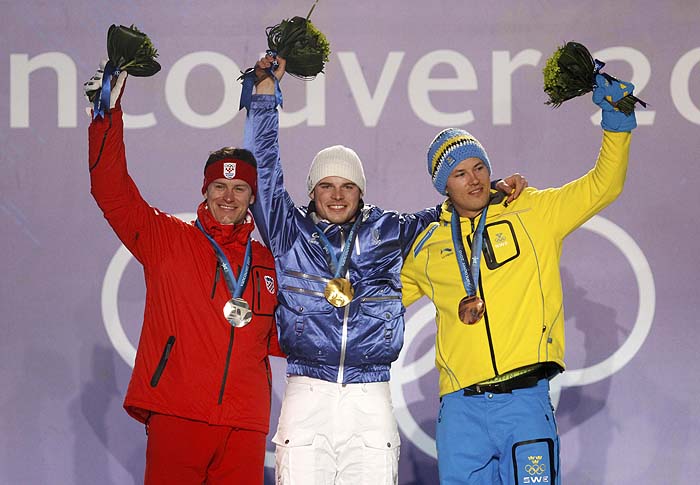 Gold medalist Giuliano Razzoli of Italy (C), silver medalist Ivica Kostelic of Croatia and bronze medlaist Andre Myhrer of Sweden celebrate on the podium during the medal ceremony for the men's slalom during the Vancouver 2010 Winter Olympics in Whistler, British Columbia, February 27, 2010.     REUTERS/Stefan Wermuth (CANADA)