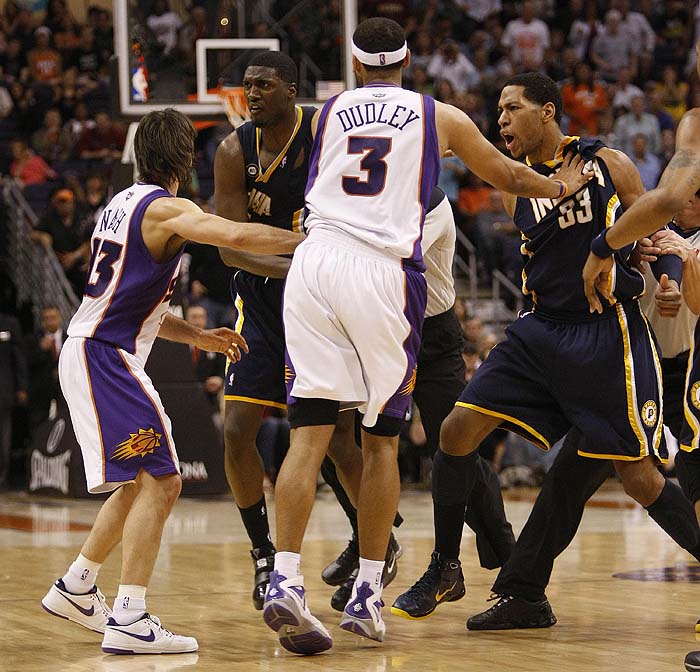 Phoenix Suns' Jared Dudley (3) and Steve Nash (13), hold back Indiana Pacers' Danny Granger (33) and Roy Hibbert after an altercation during the second half of an NBA basketball game Saturday, March 6, 2010 in Phoenix. The Suns won 113-105. (AP Photo/Matt York)
