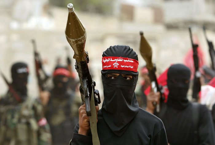 Palestinian militants from the Democratic front for the liberation of Palestine (DFLP) take part in an anti-Israel march in Gaza February 24, 2010.    REUTERS/Mohammed Salem (GAZA - Tags: POLITICS CIVIL UNREST)