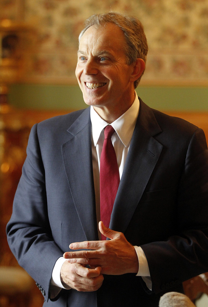 Quartet Representative Tony Blair smiles as he gives an interview to Reuters in Moscow, March 19, 2010. Middle East mediators from Europe, the United States, Russia and the U.N. met on Friday seeking to defuse the latest crisis in peace efforts between Israel and the Palestinians.  REUTERS/Alexander Natruskin  (RUSSIA - Tags: POLITICS)
