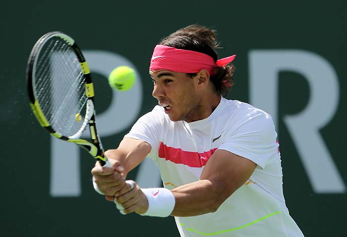 INDIAN WELLS, CA - MARCH 20: Rafael Nadal of Spain returns a backhand to Ivan Ljubicic of Croatia during the BNP Paribas Open at the Indian Wells Tennis Garden on March 20, 2010 in Indian Wells, California.   Jeff Gross/Getty Images/AFP== FOR NEWSPAPERS, INTERNET, TELCOS & TELEVISION USE ONLY ==