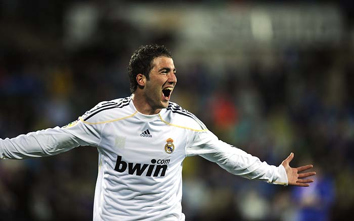 Real Madrid's Argentinian forward Gonzalo Higuain celebrates his first goal against Getafe during their Spanish League football match at Coliseum Alfonso Perez stadium in Getafe on March 25, 2010.  AFP PHOTO / PIERRE-PHILIPPE MARCOU