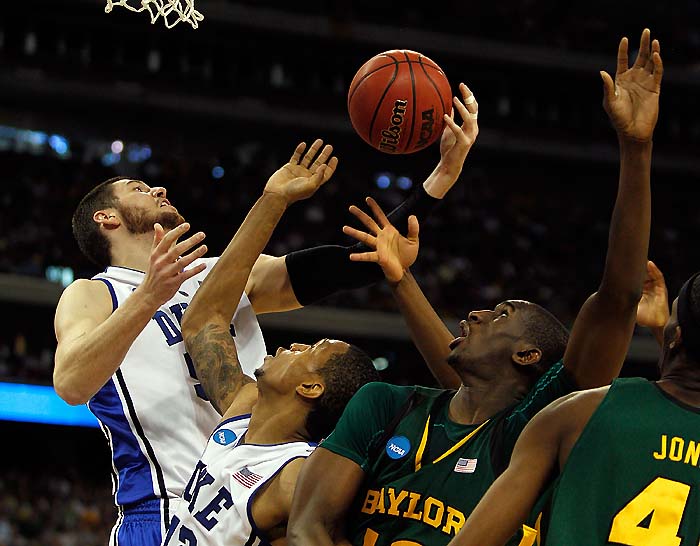 HOUSTON - MARCH 28: Brian Zoubek #55 of the Duke Dlue Devils (L) battles for a rebound with teammate Lance Thomas #42 and Ekpe Udoh #13 of the Baylor Bears during the south regional final of the 2010 NCAA men's basketball tournament at Reliant Stadium on March 28, 2010 in Houston, Texas. Duke defeated Baylor 78-71.   Jonathan Daniel/Getty Images/AFP== FOR NEWSPAPERS, INTERNET, TELCOS & TELEVISION USE ONLY ==