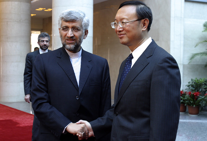 Iran's top nuclear negotiator Saeed Jalili, left, shakes hands with Chinese Foreign Minister Yang Jiechi before a meeting at Foreign Ministry in Beijing, China, Thursday, April 1, 2010. Jalili arrived Thursday for talks with Chinese officials, just after Beijing appeared to drop its opposition to possible new U.N. sanctions against Tehran over its uranium enrichment program. (AP Photo/Cathleen Chang)