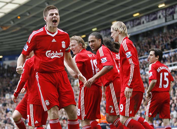 Liverpool's Steven Gerrard (L) celebrates scoring his goal against Birmingham City during a Premier League match at St Andrew's in Birmingham, West Midlands, England on April 4, 2010.   AFP PHOTO/ IAN KINGTONFOR EDITORIAL USE ONLY Additional licence required for any commercial/promotional use or use on TV or internet (except identical online version of newspaper) of Premier League/Football League photos. Tel DataCo +44 207 2981656. Do not alter/modify photo.