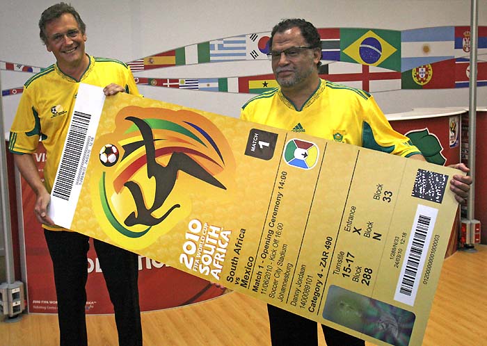 FIFA Secretary General Jerome Valcke, left, and organizing committee chief Danny Jordaan hold a giant representation of a 2010 World Cup ticket during the official 2010 FIFA World Cup ticket unveiling at the Maponya Mall in Soweto, South Africa, Friday April 9, 2010. The tickets will be made available to the general public in a week's time, on April 15, 2010, when the fifth and final ticketing sales phase kicks off. (AP Photo/Themba Hadebe)