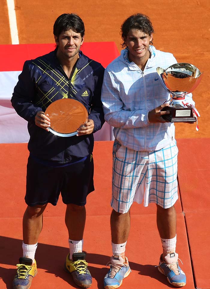 Rafael Nadal of Spain, right, holds his trophy after defeating Fernando Verdasco of Spain, left, in the final match of the Monte Carlo Tennis Masters tournament in Monaco, Sunday, April 18, 2010. (AP Photo/Lionel Cironneau)