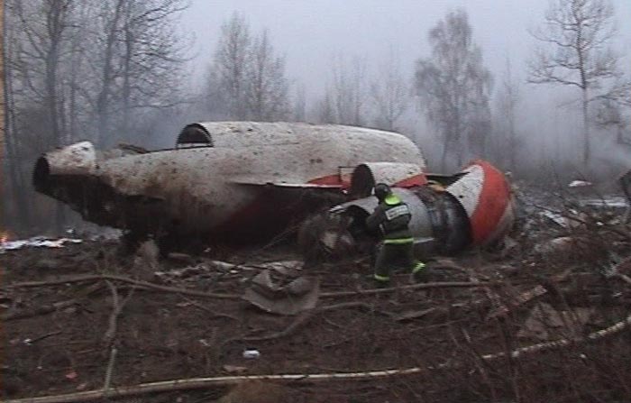 This image from Polish Television's TVP via APTN shows a firefighter walking near some of the wreckage at the crash site where Polish President Lech Kaczynski, his wife and some of the country's most prominent military and civilian leaders died Saturday April 10, 2010 along with dozens of others when the presidential plane crashed as it came in for a landing in thick fog in near Smolensk in western Russia. (AP Photo/TVP via APTN)