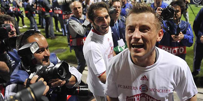 Bayern Munich's Croatian striker Ivica Olic and Bayern Munich's Turkish midfielder Hamit Altintop (L) celebrate after the 2nd leg UEFA Champions League semi-final match Olympique Lyonnais vs FC Bayern Munich at the Gerland stadium in Lyon, France on April 27, 2010. Bayern Munich won the match 0-3 and will face either FC Barcelona or Inter Milan in the final on May 22, 2010 in Madrid. AFP PHOTO DDP /  OLIVER LANG  GERMANY OUTAFP PHOTO DDP /  OLIVER LANG  GERMANY OUT