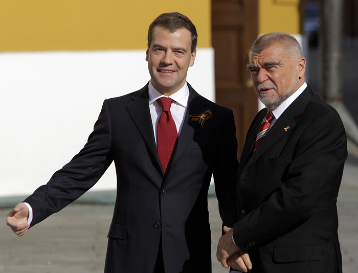 Russian President Dmitry Medvedev, left, shakes hands with Croatia's former president Stipe Mesic in Moscow's Kremlin before a Victory Day parade which commemorates the 1945 defeat of Nazi Germany, in Moscow, Sunday, May 9, 2010. (AP Photo/Alexander Zemlianichenko)