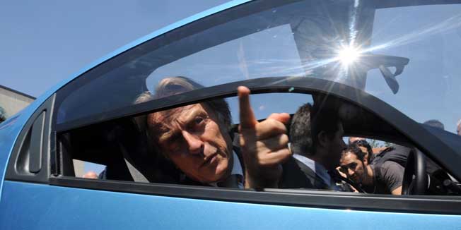 Ferrari President Luca Cordero di Montezemolo gestures from inside the new Pininfarina electric car 