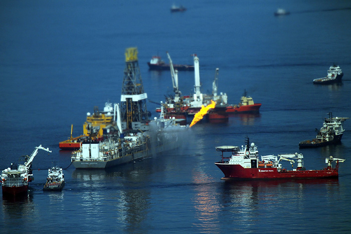 GULF OF MEXICO - JUNE 13: A flare burns from a drill ship recovering oil from the ruptured British Petroleum (BP) oil well over the site in the Gulf of Mexico on June 13, 2010 off the coast of Louisiana. The spill has been called the largest environmental disaster in American history. U.S. government scientists have estimated that the flow rate of oil gushing out of a ruptured Gulf of Mexico oil well may be as high 40,000 barrels per day. President Obama will make his fourth trip to the Gulf tomorrow.   Spencer Platt/Getty Images/AFP== FOR NEWSPAPERS, INTERNET, TELCOS & TELEVISION USE ONLY ==
