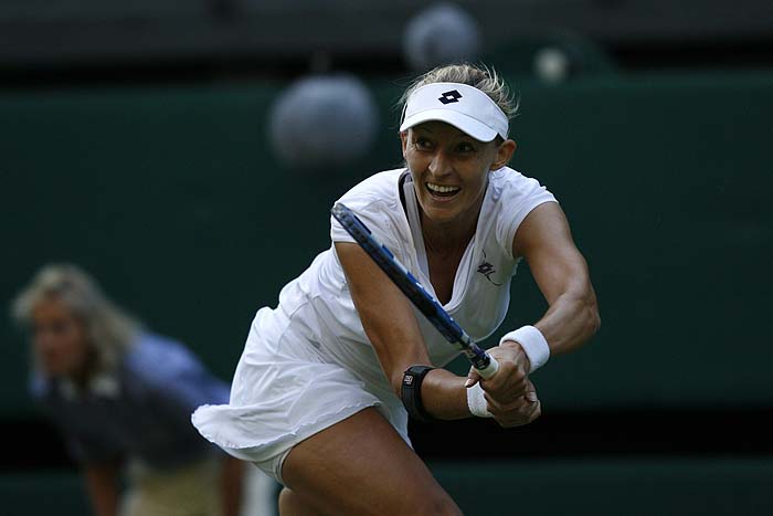  Croatia's Mirjana Lucic returns a ball to Belarus' Victoria Azarenka during the Wimbledon Tennis Championships at the All England Tennis Club, in southwest London, on June 22, 2010.   AFP PHOTO / IAN KINGTON