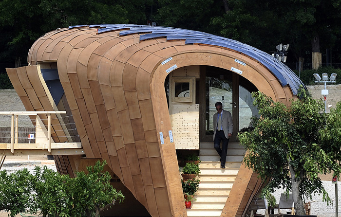 A man visits a solar house during the Solar Decathlon Europe 2011 in Madrid on June 17, 2010. Solar houses built and designed by 20 college and university student teams will be on display during The Solar Decathlon Europe competition held from June 18 to 27, 2010 in Madrid. AFP PHOTO/Pedro ARMESTRE