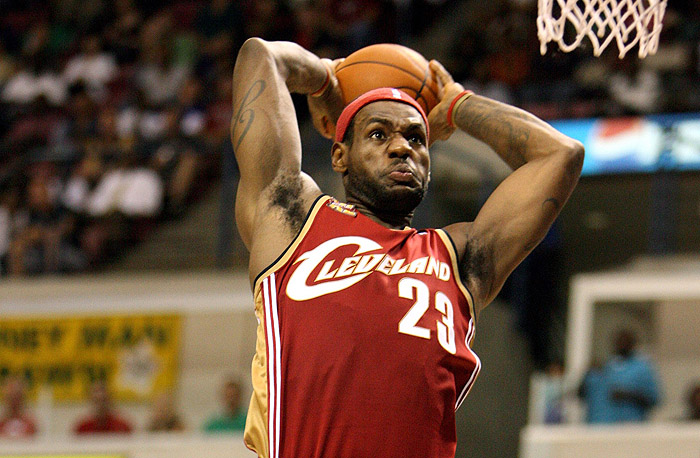 Cleveland's LeBron James flies in for a dunk during first half action against the Charlotte Bobcats during their NBA preseason basketball game at the North Charleston Coliseum in North Charleston, S.C. Saturday Oct. 10, 2009. (AP Photo/Mic Smith)