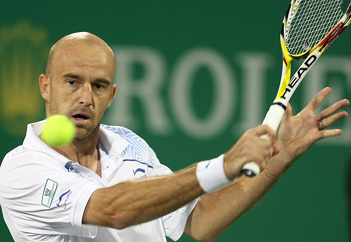 Ivan Ljubicic of Croatia plays a shot to Gael Monfils of France during the Shanghai Masters tennis tournament in Shanghai October 15, 2009. REUTERS/Aly Song (CHINA SPORT TENNIS)
