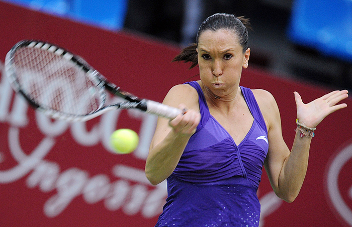 Jelena Jankovic of Serbia  plays a backhand to Alisa Kleybanova of Russia (out of camera range) during their women's singles match at the WTA Kremlin Cup tennis tournament in Moscow on October 23, 2009. AFP PHOTO / NATALIA KOLESNIKOVA