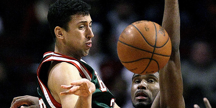Milwaukee Bucks guard Roko Ukic from Croatia, passes against the defense of  Chicago Bulls forward Derrick Byars during the fourth quarter of an NBA preseason basketball game on  Tuesday, Oct. 13, 2009 in Chicago.  The Bulls won 87-86.  (AP Photo/Charles Rex Arbogast)