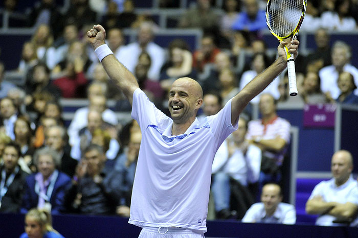 Ivan Ljubicic of Croatia celebrates after winning his final tennis match against Michael Llodra of France at the Grand Prix Tennis indoor tournament, in Lyon, central France, Sunday, Nov. 1, 2009. (AP Photo/Laurent Cipriani)