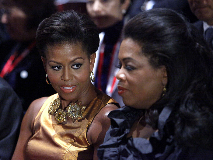 U.S. first lady Michelle Obama is seated with television talk show host Oprah Winfrey at the opening ceremonies of the the 121st International Olympic Committee (IOC) Session and XIII Olympic Congress at the Copenhagen Opera House October 1, 2009. Chicago, Madrid, Rio de Janeiro and Tokyo are competing to host the 2016 Summer Olympic Games and the IOC will choose the winning city in a vote on Friday, October 2.  REUTERS/Charles Dharapak/Pool  (DENMARK SPORT OLYMPICS POLITICS ENTERTAINMENT)