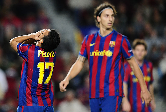 FC Barcelona's Pedro Rodriguez, left, and Zlatan Ibrahimovic from Sweden, right, react during their Group F Champions League first leg soccer match against Rubin Kazan at the Camp Nou stadium in Barcelona, Spain, on Tuesday, Oct. 20, 2009. (AP Photo/David Ramos)