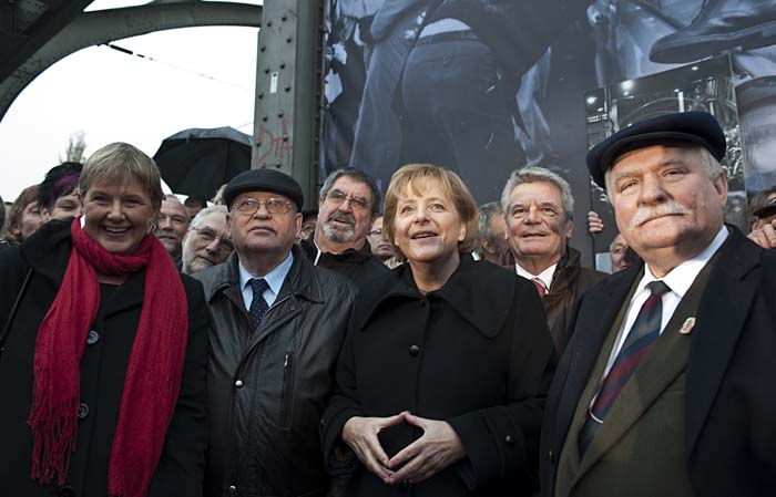 Former Soviet leader Mikhail Gorbachev, second left, German Chancellor Angela Merkel, center, and former Polish President Lech Walesa, right,  in Berlin, Germany, Monday, Nov. 9, 2009, during the commemorations of the 20th anniversary of the fall of the Berlin Wall on Nov. 9, 1989.  (AP Photo/Eckehard Schulz)