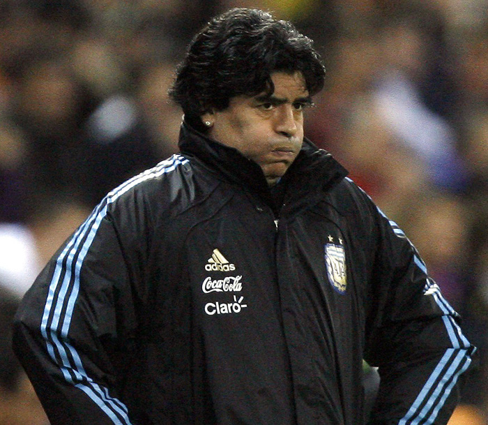 Argentina's national soccer coach Diego Maradona reacts during their friendly soccer match against Spain at the Vicente Calderon stadium in Madrid in this November 14, 2009 file photo. Maradona has been given a two-month ban and fined over $24,000 following his globally-broadcast foul-mouthed outburst at the end of last month's decisive World Cup qualifier in Uruguay. Maradona was handed the ban by FIFA's disciplinary committee on November 15, 2009.     REUTERS/Nacho Doce/Files (SPAIN SPORT SOCCER)