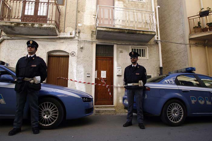 Italian police officers patrol the hideout apartment of Mafia Boss Domenico Raccuglia, in Calatafimi, near Trapani, Sicily, southern Italy, Monday, Nov. 16, 2009. Police captured the Sicilian top Mafia fugitive on Sunday, dealing a stiff blow to the island's Cosa Nostra crime syndicate, Italian officials said. Convicted mobster Domenico Raccuglia, who has been on the run for 15 years, now faces several life sentences for crimes including the murder of a rival's 9-year-old son, whose body was then thrown into a vat of acid.  Raccuglia was arrested in an apartment in a tiny town near Trapani, where he is believed to have had his power base, police said. (AP Photo/Alessandro Fucarini) 
