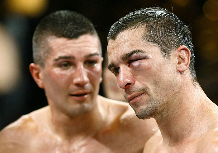 Stjepan Bozic of Croatia reacts beside Dimitri Sartison (L) of Germany following their super middleweight WBA world championship boxing fight in Kiel November 21, 2009.   REUTERS/Christian Charisius  (GERMANY SPORT BOXING)