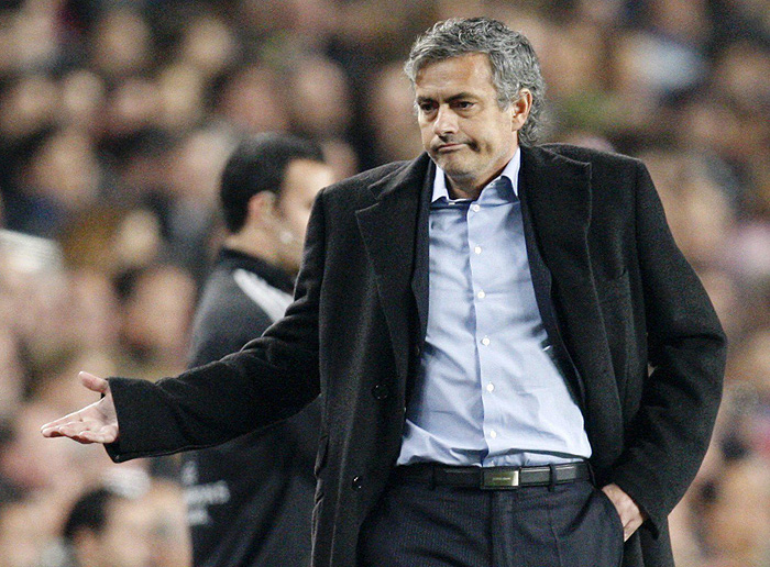 Inter Milan's coach Jose Mourinho reacts after Barcelona scored their second goal during their Champions League soccer match at Nou Camp stadium in Barcelona November 24, 2009. REUTERS/Giampiero Sposito (SPAIN SPORT SOCCER IMAGES OF THE DAY)