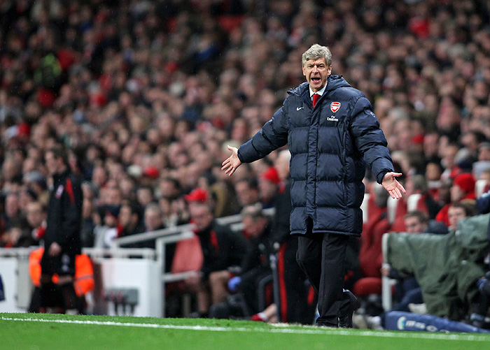 Arsenal's French manager Arsene Wenger issues instructions during the English Premier League football match between Arsenal and Stoke City  at the Emirates stadium, north London on December 5, 2009. AFP PHOTO/Chris RatcliffeFOR EDITORIAL USE ONLY Additional licence required for any commercial/promotional use or use on TV or internet (except identical online version of newspaper) of Premier League/Football League photos. Tel DataCo +44 207 2981656. Do not alter/modify photo.