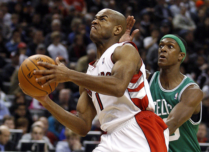 Toronto Raptors guard Jarrett Jack goes to the basket past Boston Celtics guard Rajon Rondo (R) during the first half of their preseason NBA basketball game in Toronto October 18, 2009.   REUTERS/ Mike Cassese   (CANADA SPORT BASKETBALL)