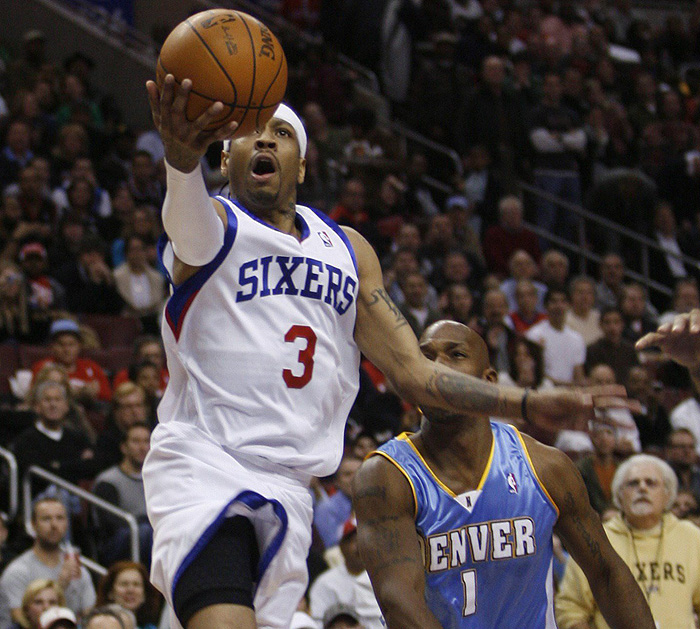Philadelphia 76ers guard Allen Iverson (3) shoots past the defense of the Denver Nuggets Chauncey Billups (1) during the first quarter of their NBA basketball game in Philadelphia, Pennsylvania, December 7, 2009. Iverson has returned to the 76ers after being traded to the Nuggets in 2006.  REUTERS/Tim Shaffer (UNITED STATES SPORT BASKETBALL)