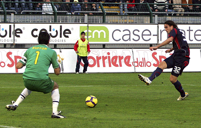 Cagliari's Alessandro Matri, right, scores past Juventus goalie Gianluigi Buffon during their Serie A soccer match in Cagliari, Italy, Sunday, Nov. 29, 2009. Cagliari won 2-0. (AP Photo/Daniela Santoni)